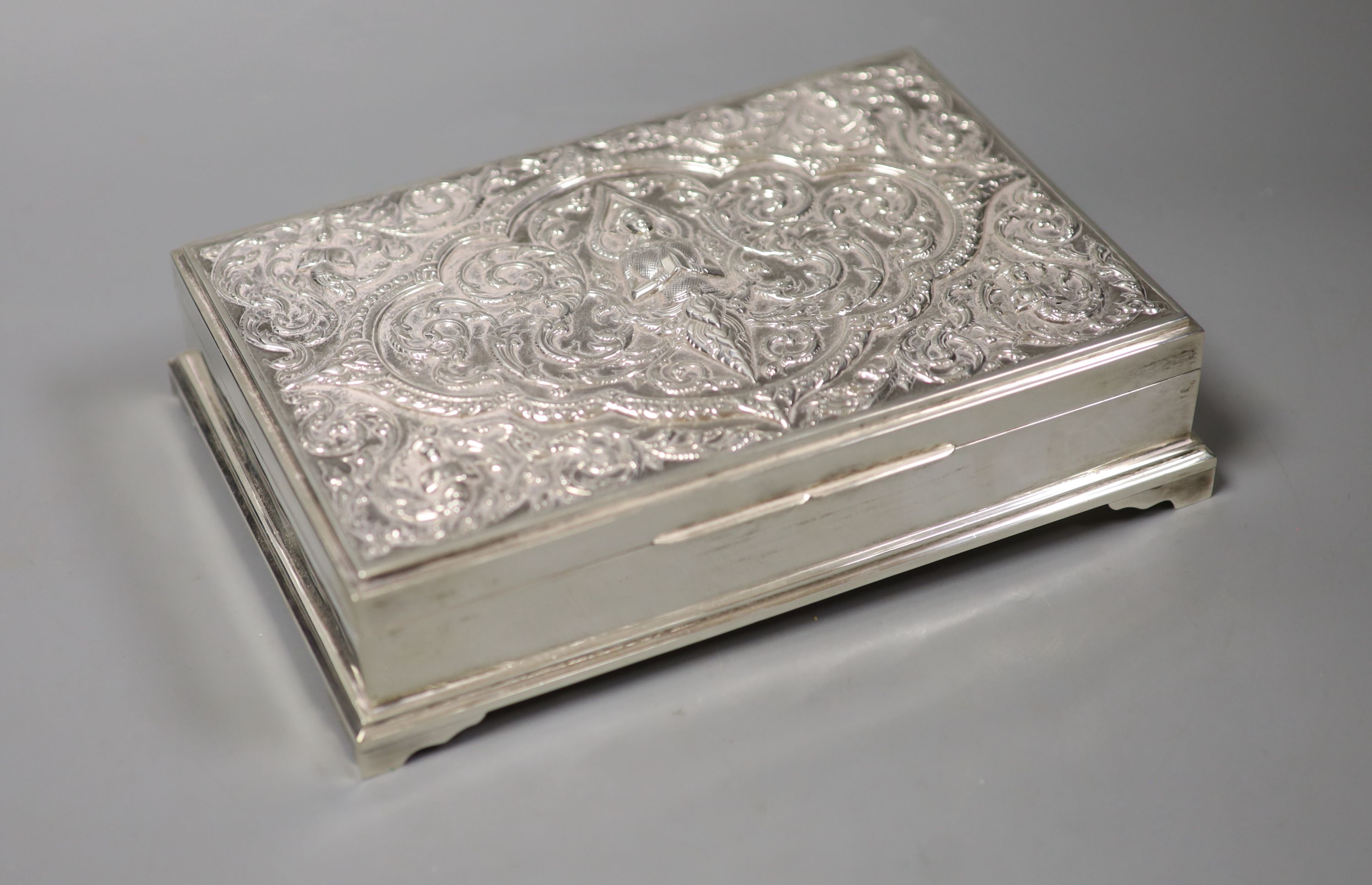 A Thai rectangular white metal cigarette box, 23.9cm,